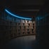 Shelves of records and sheet music curving into the depth of a dark archive, lit by a blue rim light