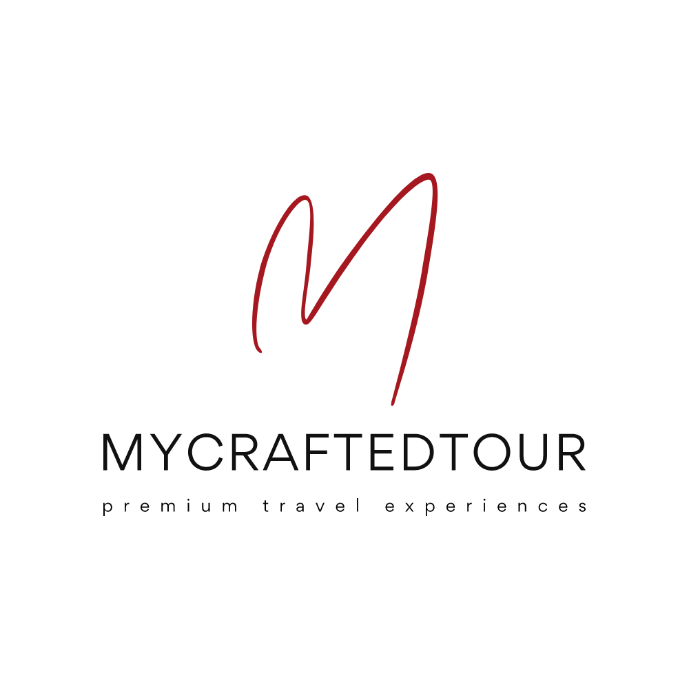 MyCraftedTour logo with a red script "M" above "MYCRAFTEDTOUR" and "premium travel experiences".