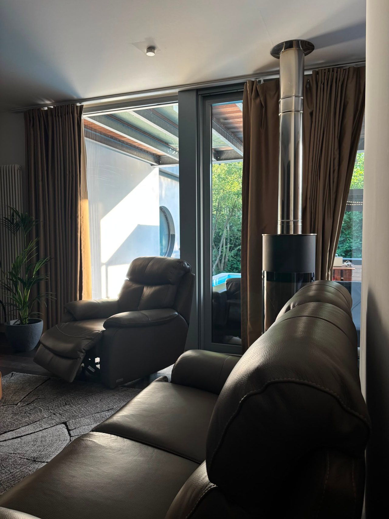 Wellness Oase – Wohnzimmer mit Kaminofen