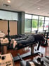 A man lies face down on a spinal decompression treatment table.