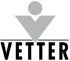 Graues V-förmiges Logo mit Kreis darüber auf dunklem Hintergrund, darunter der schwarze Text "VETTER".