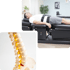 Man lying on a spinal decompression table, and a model of a human spine