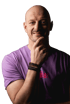 Bald man in a purple t-shirt with "Müller" text, hand on chin, smiling.