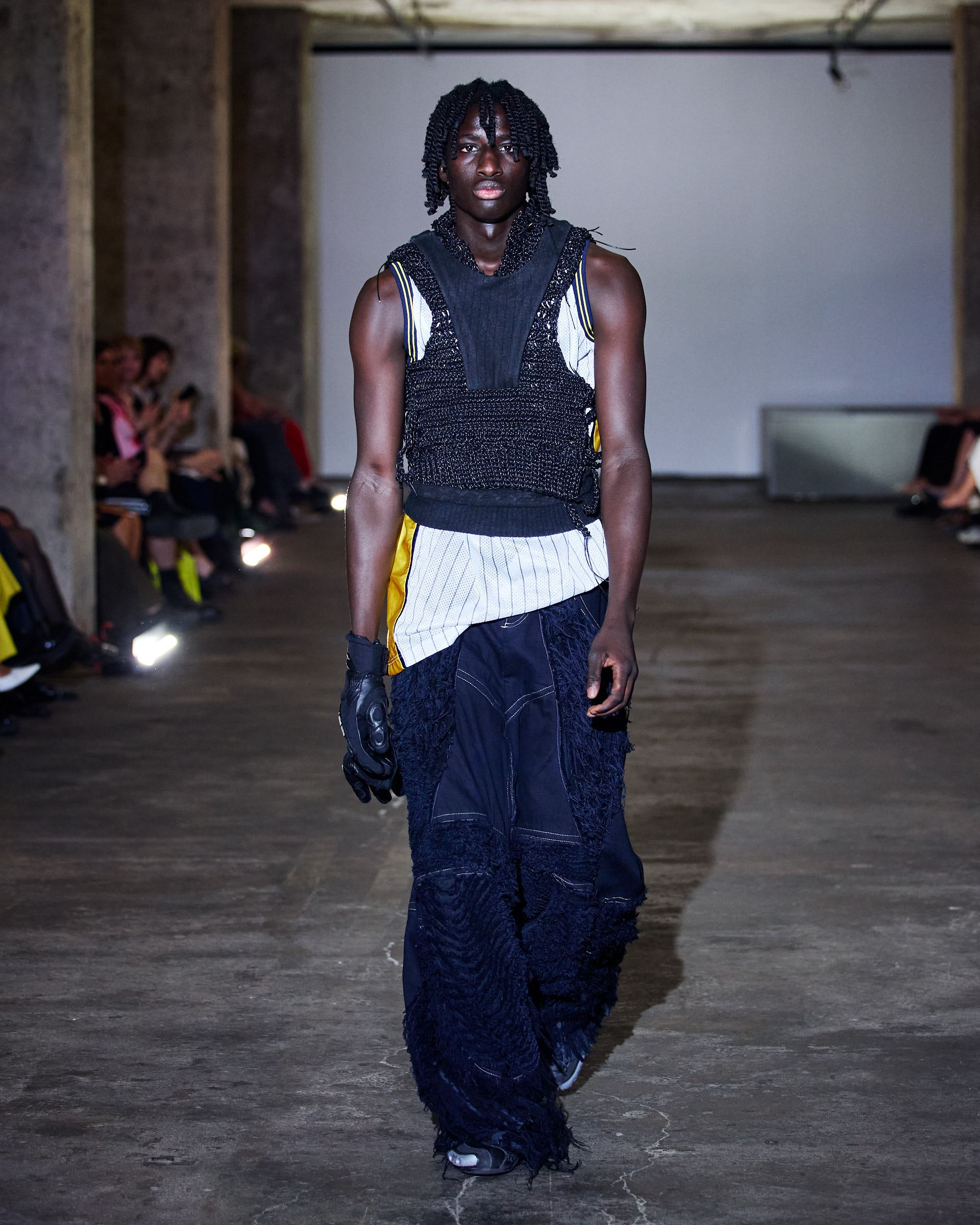 Hand-crocheted leather top with distressed denim jeans