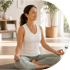 Woman with eyes closed meditating in a cross-legged position on a yoga mat