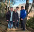 Outdoor wellness scene with multigenerational group on steps in nature