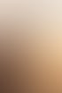 Blurred silhouette of a person against an orange and yellow sunset sky.