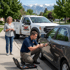 Towing Sandy car lockout service unlocking a vehicle door for a stranded driver using specialized lockout tools in a residential neighborhood.