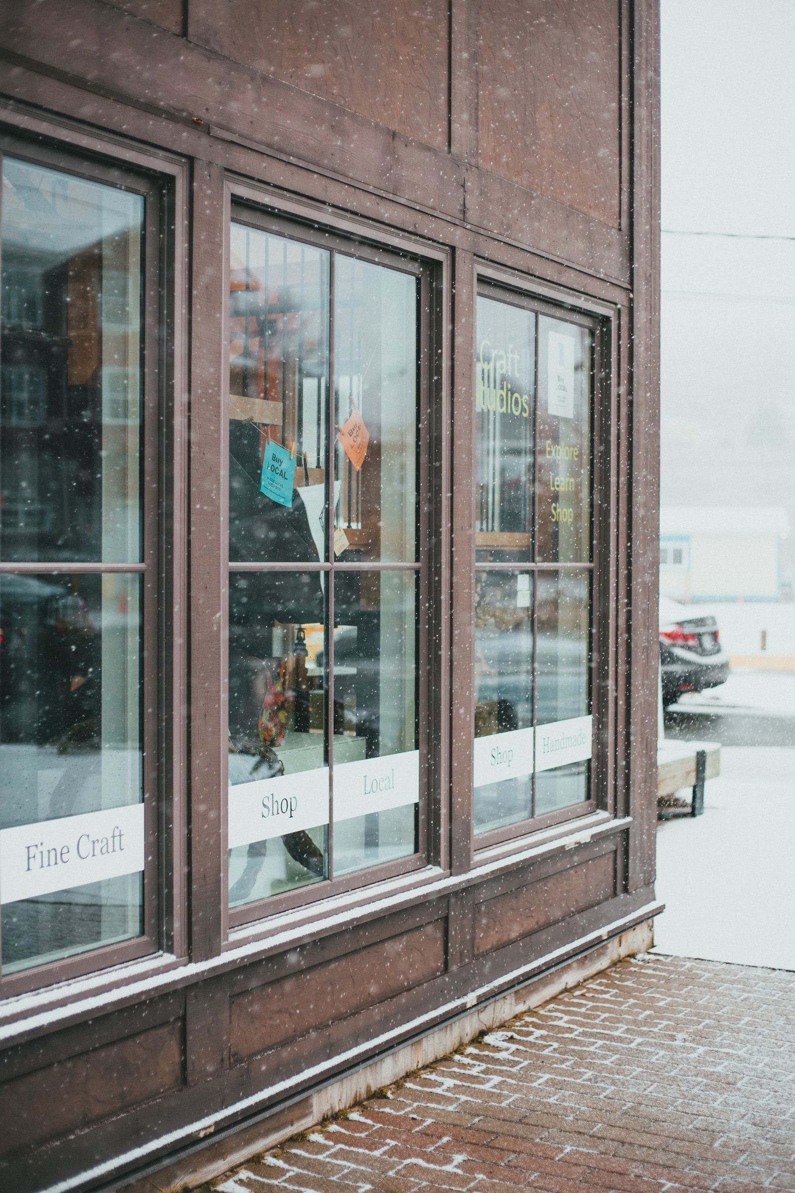 Commercial storefront glazing along a small business frontage