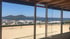 Blick aus einem Fenster auf das Meer mit Inseln und einem Campingplatz am Ufer von der Villa Aperol in Drage Kroatien.