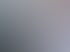 Drei Männer in Arbeitskleidung sitzen an einem Tisch und besprechen gemeinsam Dokumente in einem hellen Büro.