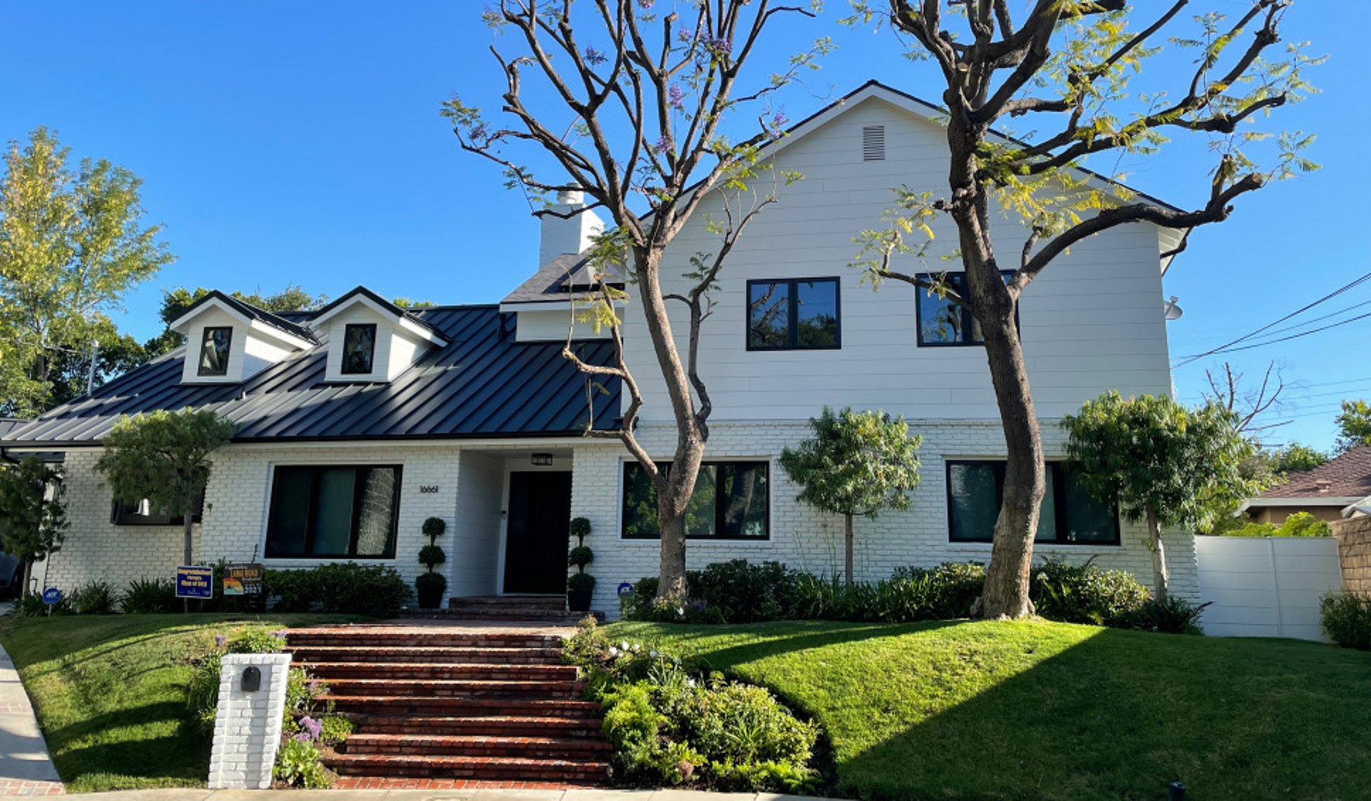 Home with white brick and arctic white James Hardie siding in Encino, CA installed by Approved Contractor, Inc.