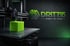 3D-Drucker druckt einen leuchtend grünen Würfel; DRITT3D Logo und Text "3D-DRUCK | CAD | 3D-SCAN".