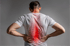 Man with lower back pain, possible herniated disc affecting spine