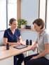 Healthcare professional discussing supplements with a patient during a consultation