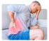 Man experiencing back pain, holding his highlighted lower back.