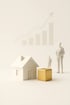 Abstraktes Hausmodell mit goldenem Würfel, minimalistische Szene – Symbol für halal investieren & sparen.