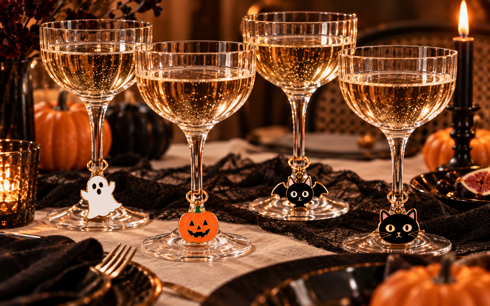 Halloween wine glass charms styled on a party table