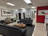 Waiting room with leather couches and coffee table at Miller Whitmer Chiropractic