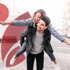 A joyful man gives a woman a piggyback ride, celebrating their recovery.
