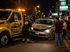 Towing Eastvale accident towing service recovering a damaged sedan at night.