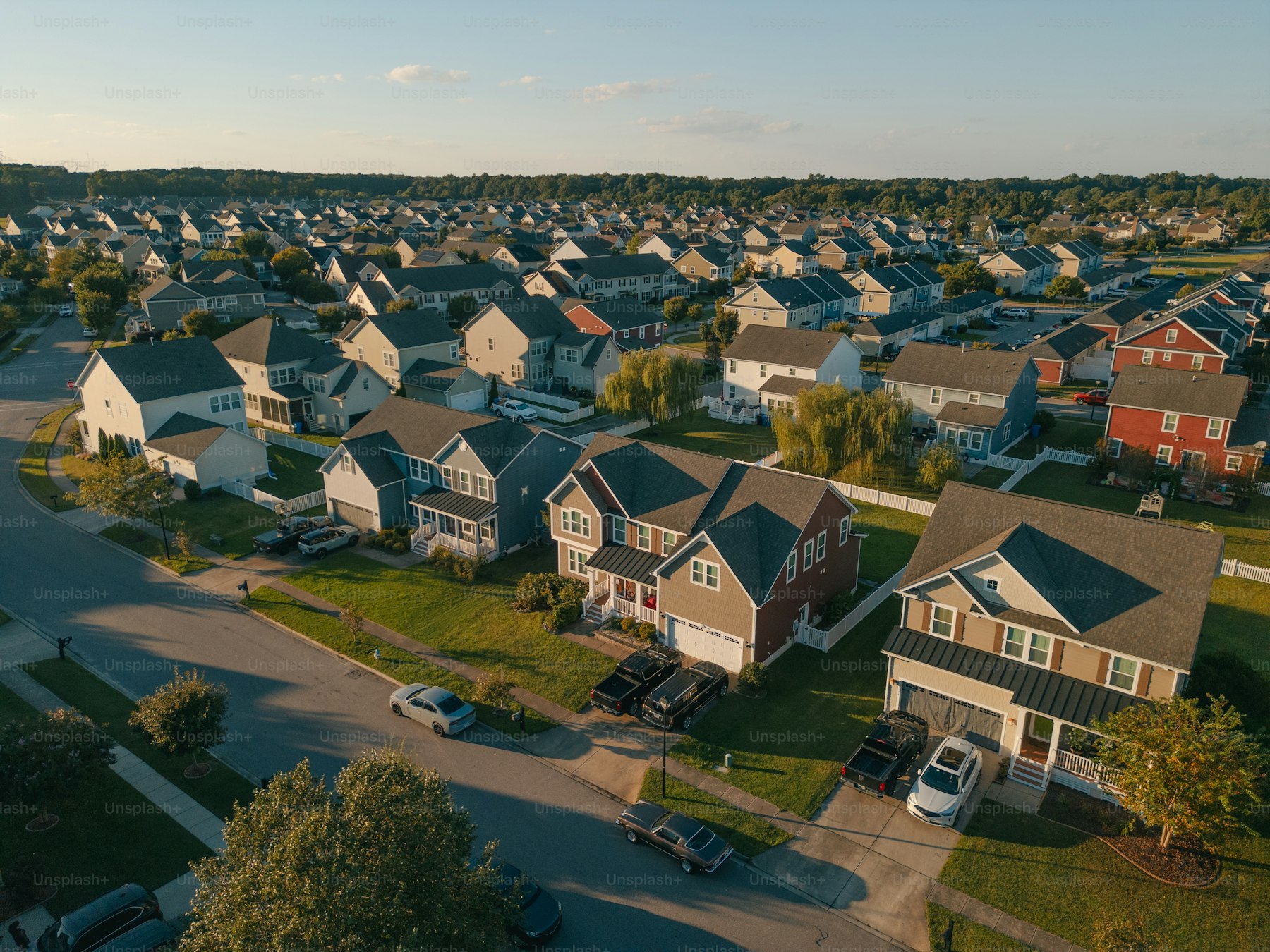Aerial view of a Fort Bend County residential neighborhood at golden hour