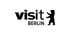 Schwarzer Text "visit BERLIN" mit einem stilisierten Berliner Bären, der rechts vom Text steht.