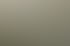 Ein Mann und ein Junge sitzen zusammen auf einer Wiese mit Büschen und Bäumen im Hintergrund.