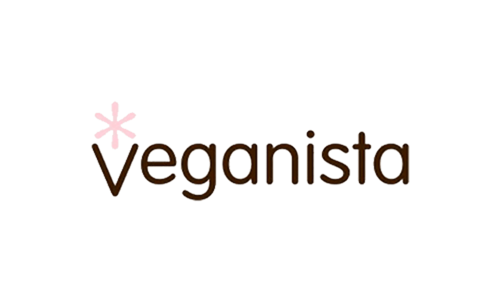 Brauner Veganista Schriftzug auf schwarzem Hintergrund mit einem rosa Sternchen über dem Buchstaben V.