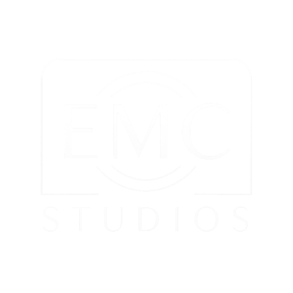 White "EMC" in a circular outline above "STUDIOS" within a rounded rectangular outline on a dark green background.