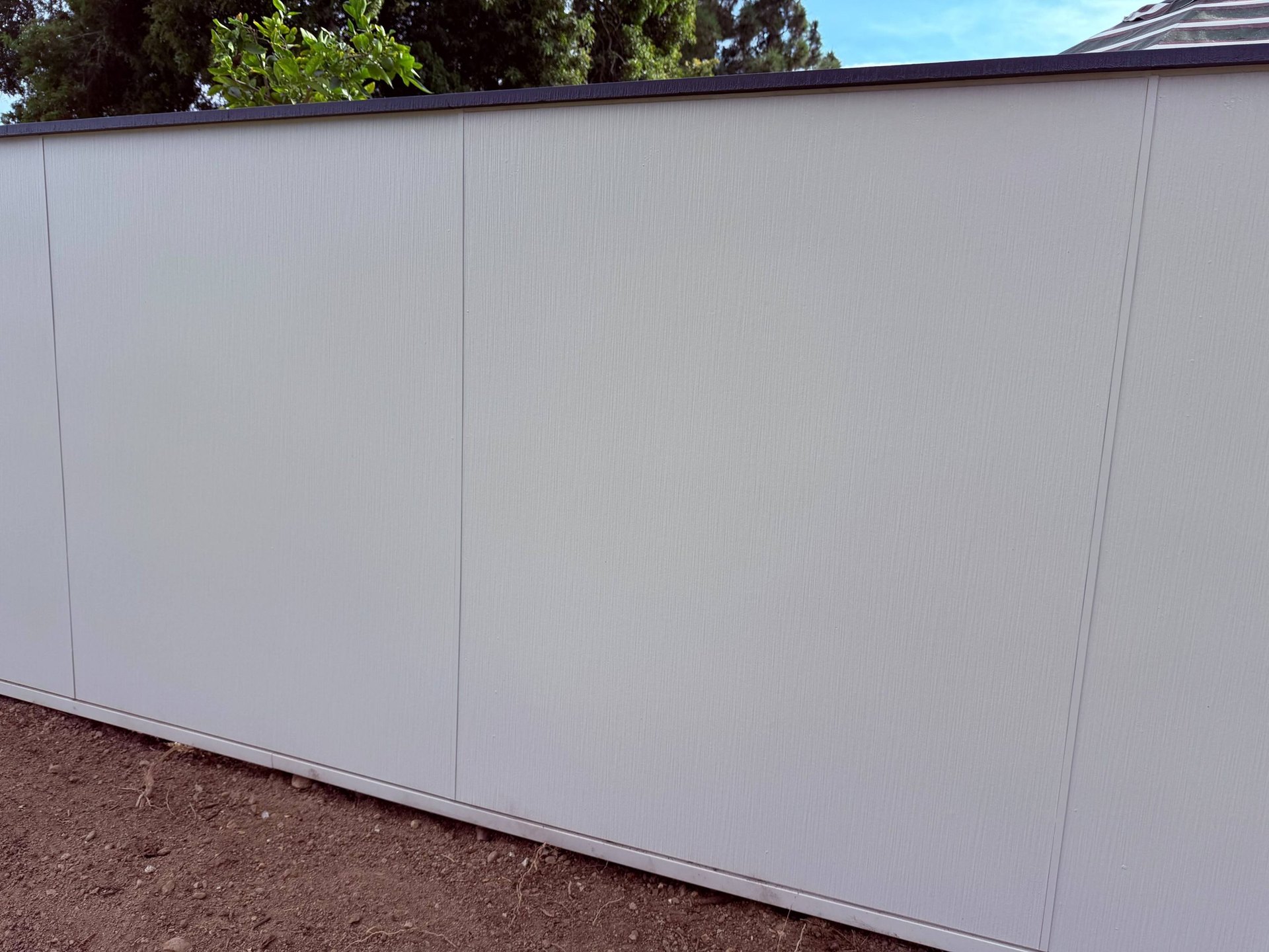 Close-up of a James Hardie Architectural Panel fence wall in San Diego