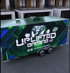 Uplifted Gaming NYC trailer with a green, black, and blue wrap featuring a game controller logo.