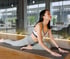 Woman stretching in pigeon pose to improve hip mobility and ease pain