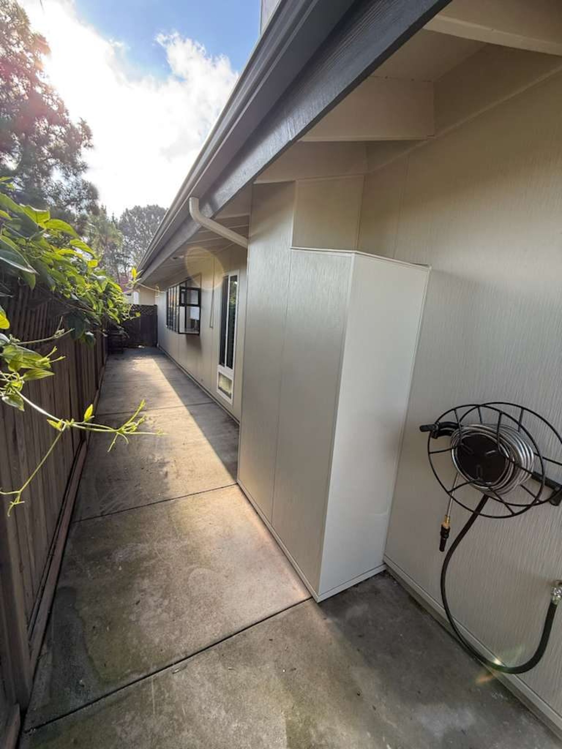 Narrow side yard with James Hardie Architectural Panel siding on a San Diego home