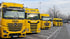 Mehrere Autotransporter der Hess Fahrzeuglogistik auf einem Autobahnparkplatz.