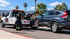 Towing Corona wheel lift towing service safely lifting an SUV for roadside transport.