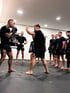Zwei Athleten in Kampfhaltung beim MMA Training im Kampfiq Studio Leipzig
