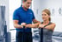Physical therapist helps woman with resistance band exercise for rehab