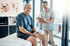 A patient consults with a chiropractor.