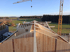 Montage des Holzdachs einer Halle in Kirchstetten mit Baukran