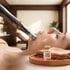 Microneedling device applied to a person's face next to a glass vial labeled PRP SERUM.