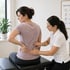 Chiropractor evaluates lower back for structural imbalance and pain care