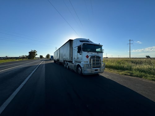 Semi truck stopped on a highway shoulder, the situation at a commercial truck breakdown near Corona, CA