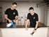 Two upholstery cleaning professionals from Aclean Steamers performing sofa deep cleaning in a modern Raleigh home using eco-friendly equipment.