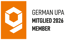 Orangefarbenes Logo mit weißem, stilisiertem "g"; daneben Text: GERMAN UPA MITGLIED 2026 MEMBER.