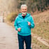 Older man jogging outdoors, to help with hip pain