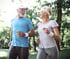 Active seniors jogging outdoors in comfy gear easing hip pain and bursitis