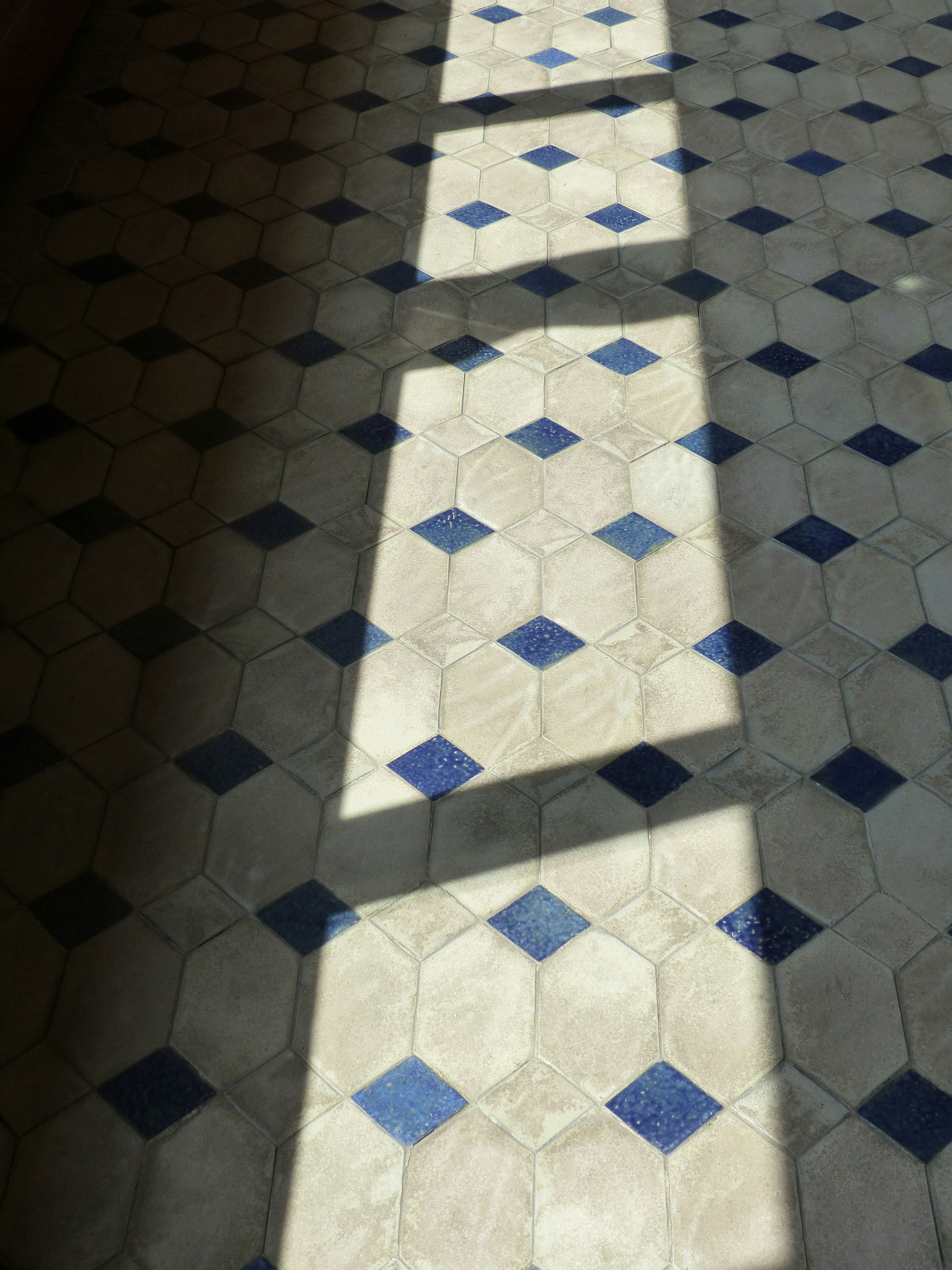 Tile and wood flooring samples laid out on a Daly City job site
