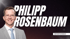 Philip Rosenbaum lächelt, mit leuchtenden FEEDBACK-Schriftzug und gebogenem Pfeil.