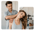A male chiropractor stretches a female patient's neck.